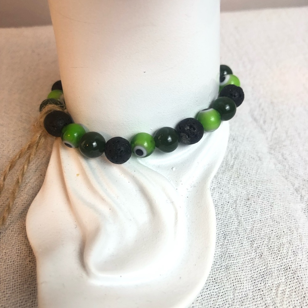 Handmade by: Kayk Green Evil eye, Jade, & Lavastone bracelet 6.25” stretchy #197